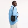 Mochila tipo bandolera Racer en Signature Canvas