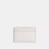 Portatarjetas Essential de Disney X Coach con Pluto