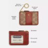 Portatarjetas Essential Mini en Signature Canvas
