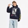 Sudadera con capucha holgada y collage de dinosaurios en algodón orgánico