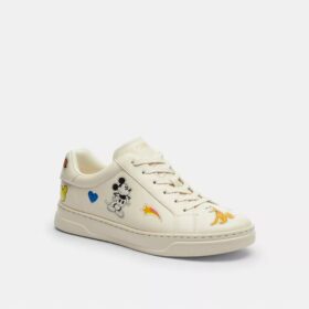 Zapatillas altas de Disney x Coach con estampado de calcomanías