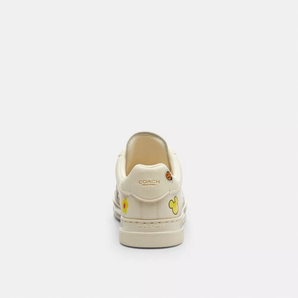 Zapatillas altas de Disney x Coach con estampado de calcomanías