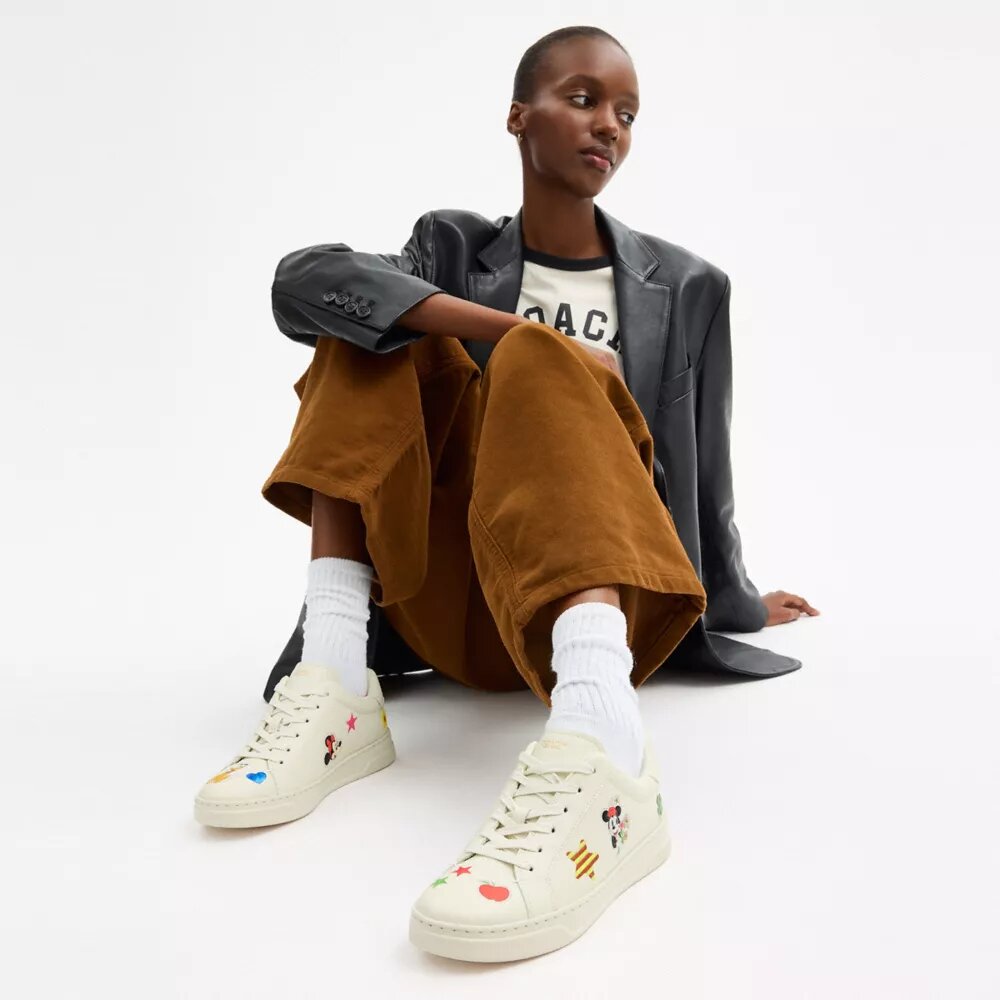 Zapatillas altas de Disney x Coach con estampado de calcomanías